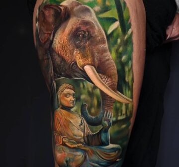 Будда и слон, тату на бедре у девушки
